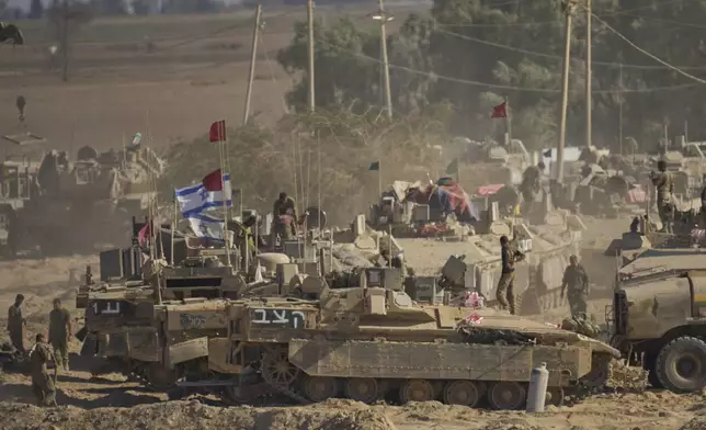 Israeli soldiers are seen near the Gaza Strip border in southern Israel, Wednesday, Aug. 6, 2025. (AP Photo/Ohad Zwigenberg)