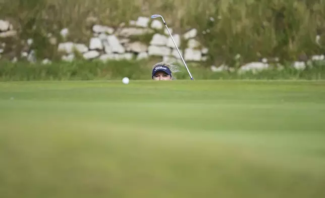 Sara Kouskova of Czech Republic plays a shot onto a 9th green during the second round of the Women's British Open golf championship, at Royal Porthcawl Golf Club in Porthcawl, Wales, Friday, Aug. 1, 2025. (AP Photo/Kin Cheung)
