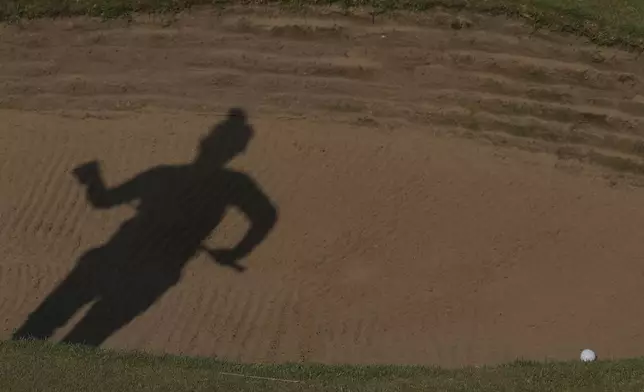 Miyu Yamashita of Japan prepares to play out of a bunker on the 17th green during the third round of the Women's British Open golf championship, at Royal Porthcawl Golf Club in Porthcawl, Wales, Saturday, Aug. 2, 2025. (AP Photo/Kin Cheung)