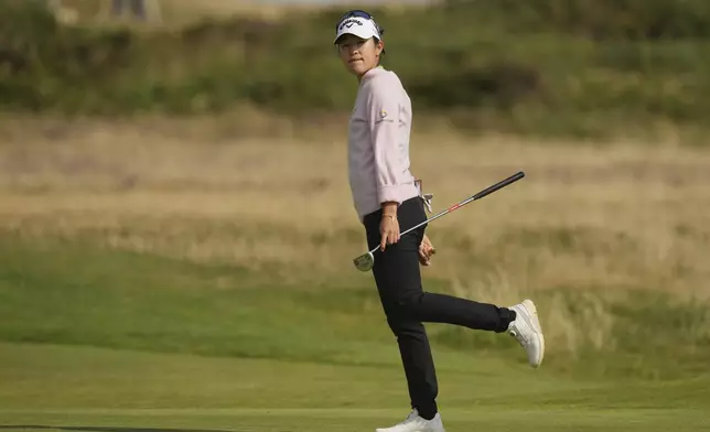 Andrea Lee of the United States reacts after putting on the 14th green during the third round of the Women's British Open golf championship, at Royal Porthcawl Golf Club in Porthcawl, Wales, Saturday, Aug. 2, 2025. (AP Photo/Kin Cheung)