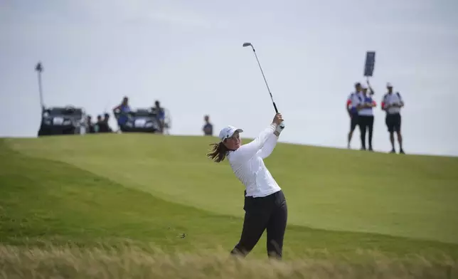 Lottie Woad of England competes during the first round of the Women's British Open golf championship, at Royal Porthcawl Golf Club in Porthcawl, Wales, Thursday, July 31, 2025. (AP Photo/Kin Cheung)