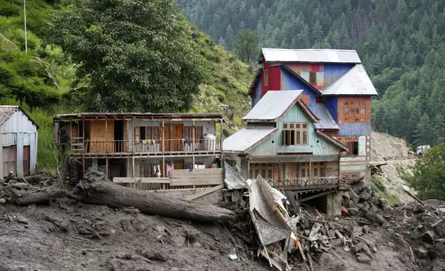 Buildings damaged by Thursday's flash floods are seen in Chositi village, Kishtwar district, Indian-controlled Kashmir, Friday, Aug. 15, 2025. (AP Photo/Channi Anand)