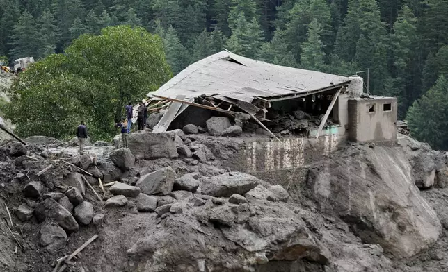 A building damaged by Thursday's flash floods is seen in Chositi village, Kishtwar district, Indian-controlled Kashmir, Friday, Aug. 15, 2025. (AP Photo/Channi Anand)