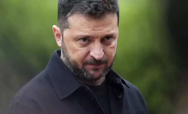 Ukraine's President Volodymyr Zelenskyy speaks in Lafayette Park, across from the White House, after meeting with President Donald Trump and European leaders Monday, Aug. 18, 2025, in Washington. (AP Photo/Jacquelyn Martin)