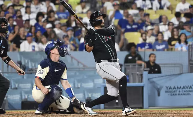 Arizona Diamondbacks Ildemaro Vargas hots a three-run home run against the Los Angeles Dodgers in the ninth inning of a baseball game Saturday, Aug. 30, 2025, in Los Angeles. (AP Photo/Wally Skalij)