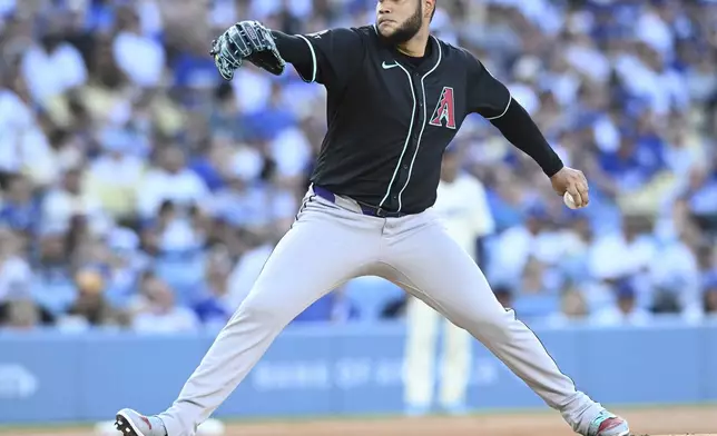 Arizona Diamondbacks pitcher Eduardo Rodriguez throws a pitch against the Los Angels Dodgers in the first inning of a baseball game Saturday, Aug. 30, 2025, in Los Angeles. (AP Photo/Wally Skalij)