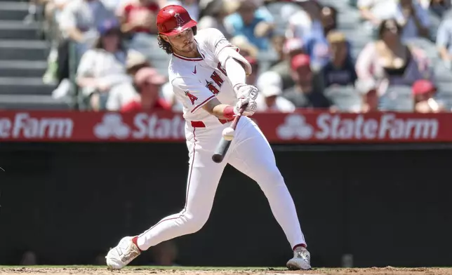 Los Angeles Angels' Bryce Teodosio makes contact with the ball during the third inning of a baseball game against the Chicago Cubs Sunday, Aug. 24, 2025, in Anaheim, Calif. (AP Photo/Eric Thayer)