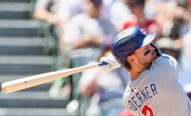 Chicago Cubs' Nico Hoerner hits a double during the fourth inning of a baseball game against the Los Angeles Angels, Sunday, Aug. 24, 2025, in Anaheim, Calif. (AP Photo/Eric Thayer)