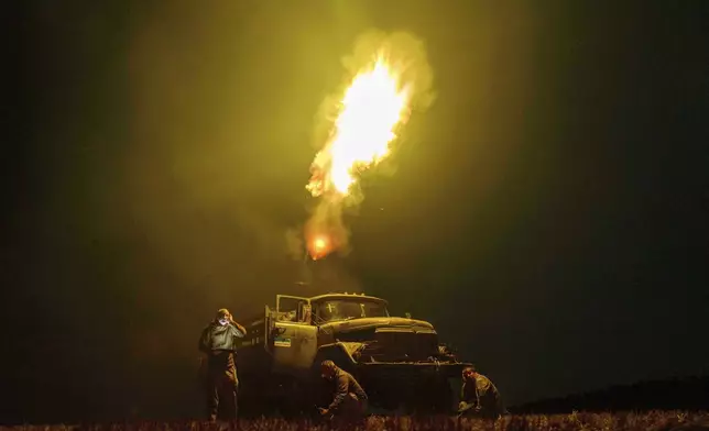 FILE - Ukrainian soldiers from air-defense unit fire at Russian drones in the Dnipropetrovsk region of Ukraine, Sunday, Aug. 10, 2025. (AP Photo/Evgeniy Maloletka, File)