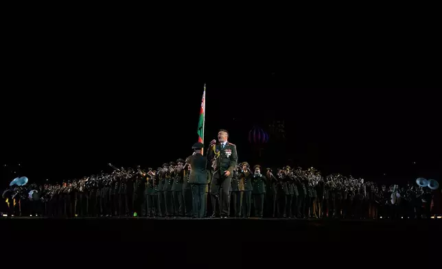 Members of the Belarusian Band of the Honor Guard of the Minsk Military Commandant's Unit perform during a dress rehearsal of the Spasskaya Tower International Military Music Festival on the Red Square in Moscow, Russia, Thursday, Aug. 21, 2025. (AP Photo/Pavel Bednyakov)
