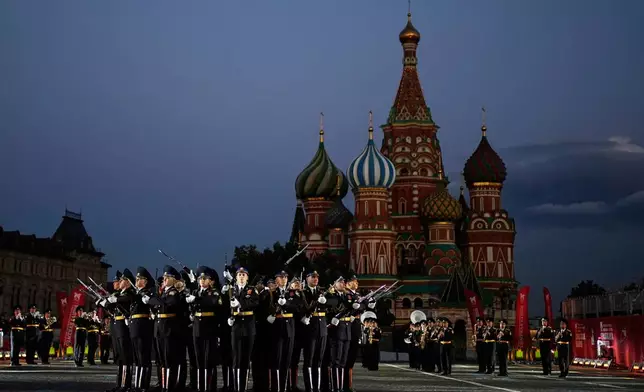 Members of The Honor Guard of the Russian Presidential Regiment perform during a dress rehearsal of the Spasskaya Tower International Military Music Festival on the Red Square in Moscow, Russia, Thursday, Aug. 21, 2025. (AP Photo/Pavel Bednyakov)