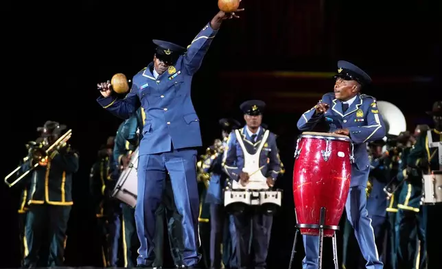 Members of the Zimbabwe Defense Forces Band perform during a dress rehearsal of the Spasskaya Tower International Military Music Festival on the Red square in Moscow, Thursday, Aug. 21, 2025. (AP Photo/Pavel Bednyakov)