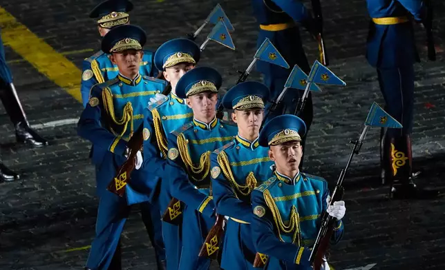 Members of The Central Military Band of the National Military-Patriotic Center of the Kazakhstan perform during a dress rehearsal of the Spasskaya Tower International Military Music Festival on the Red square in Moscow, Thursday, Aug. 21, 2025. (AP Photo/Alexander Zemlianichenko)