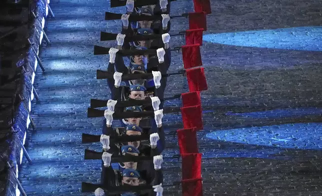 Soldiers of The Combined Military Band of the Russian Airborne Force perform during a dress rehearsal of the Spasskaya Tower International Military Music Festival in Red Square in front of the St. Basil Cathedral and the Spasskaya Tower in Moscow, Russia, on Thursday, Aug. 21, 2025. (AP Photo/Alexander Zemlianichenko)