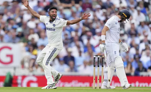 India's Mohammed Siraj celebrates the dismissal of England's Jacob Bethell, right, during the second day of the fifth cricket test match between England and India at The Kia Oval in London, Friday, Aug. 1, 2025. (AP Photo/Kirsty Wigglesworth)