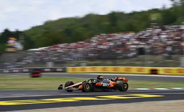 McLaren driver Oscar Piastri of Australia steers his car during the first free practice at the Hungaroring racetrack in Mogyorod, Hungary, Friday, Aug. 1, 2025, ahead of the Hungarian Formula One Grand Prix. (AP Photo/Denes Erdos)