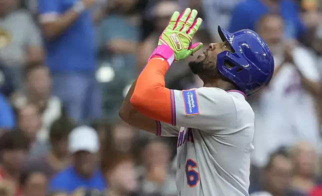 New York Mets' Starling Marte gestures after hitting a solo home run during the second inning of a baseball game against the Milwaukee Brewers, Friday, Aug. 8, 2025, in Milwaukee. (AP Photo/Aaron Gash)
