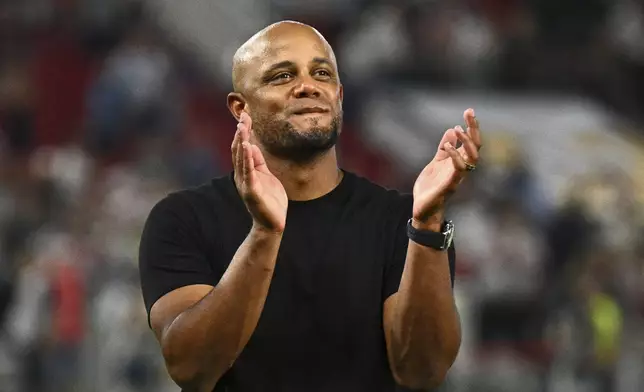 Bayern's coach Vincent Kompany celebrates after winning the German Supercup final soccer match between VfB Stuttgart and Bayern Munich in Stuttgart, Germany, Saturday, Aug. 16, 2025. (Tom Weller/dpa via AP)