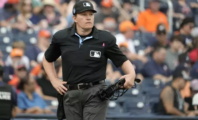 FILE - Home plate umpire Jen Pawol takes her position during the first inning of a spring training baseball game between the Houston Astros and Miami Marlins Sunday, March 10, 2024, in West Palm Beach, Fla. (AP Photo/Jeff Roberson, File)