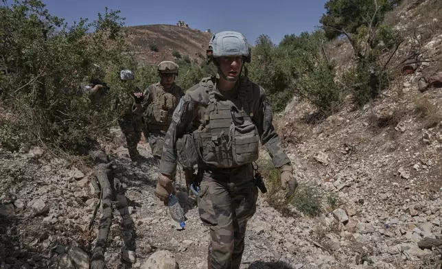 French U.N. peacekeepers patrol the Saluki Valley in south Lebanon as they search for Hezbollah weapons, Wednesday, Aug. 20, 2025. (AP Photo/Hussein Malla)