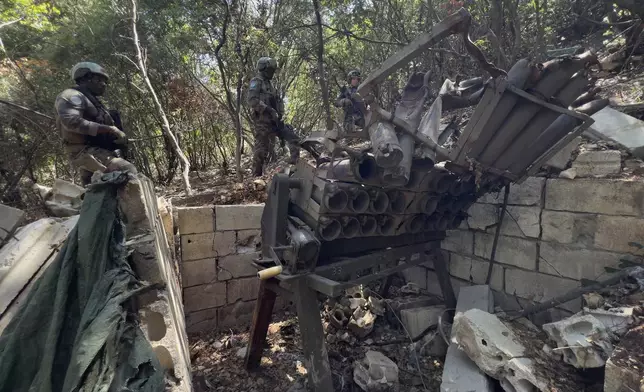French U.N. peacekeepers inspect a destroyed Hezbollah position in the Saluki Valley, southern Lebanon, Wednesday, Aug. 20, 2025. (AP Photo/Hussein Malla)