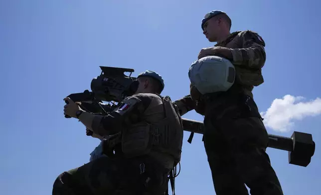 French U.N. peacekeepers use a Mistral air-defense system while inspecting their base in Deir Kifa, southern Lebanon, Wednesday, Aug. 20, 2025. (AP Photo/Hussein Malla)