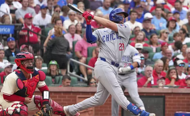 Chicago Cubs' Michael Busch follows through on a three-run home run during the second inning of a baseball game against the St. Louis Cardinals Saturday, Aug. 9, 2025, in St. Louis. (AP Photo/Jeff Roberson)