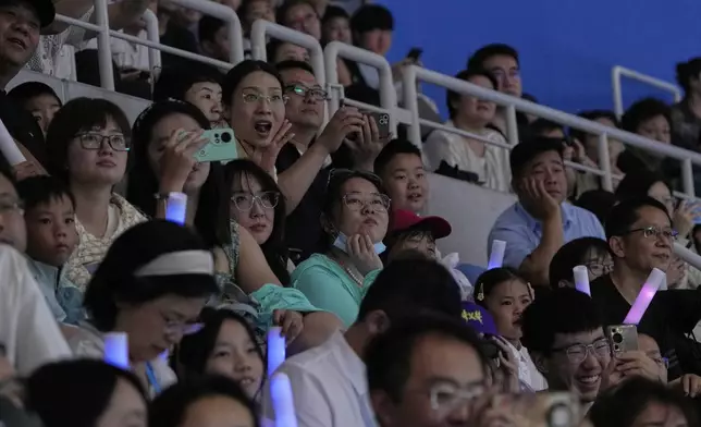 People attend the opening ceremony of the World Humanoid Robot Games held in Beijing, China, Thursday, Aug. 14, 2025. (AP Photo/Mahesh Kumar A.)