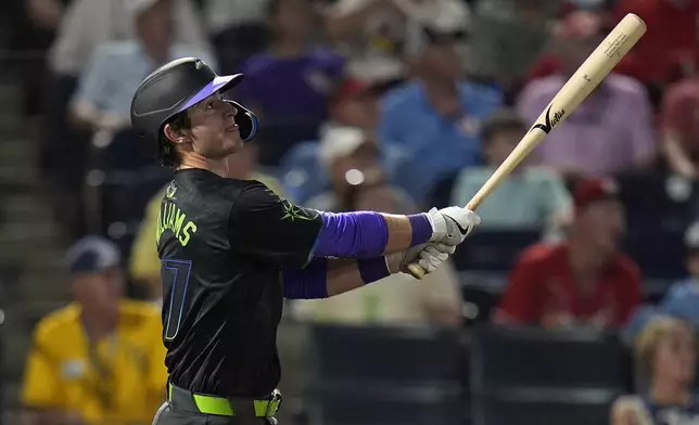 Tampa Bay Rays' Carson Williams watches his two-run home run off St. Louis Cardinals pitcher Ryan Fernandez during the seventh inning of a baseball game Friday, Aug. 22, 2025, in Tampa, Fla. (AP Photo/Chris O'Meara)
