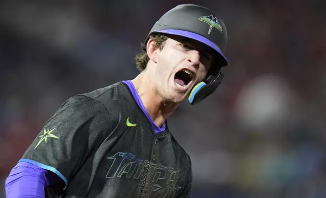 Tampa Bay Rays' Carson Williams reacts after his two-run home run off St. Louis Cardinals pitcher Ryan Fernandez during the seventh inning of a baseball game Friday, Aug. 22, 2025, in Tampa, Fla. (AP Photo/Chris O'Meara)