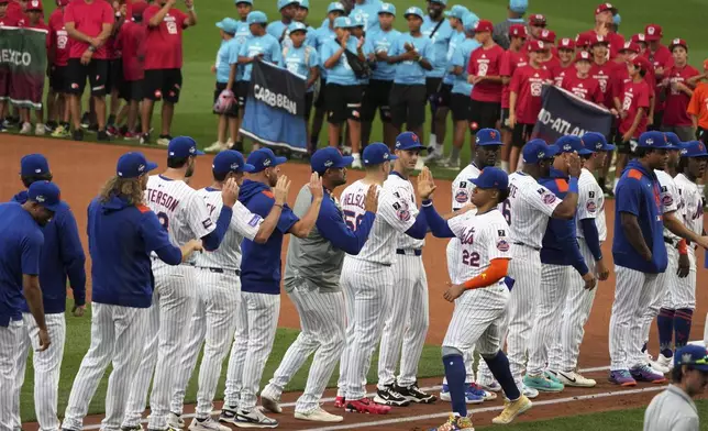 New York Mets outfielder Juan Soto is introduced before the Little League Classic baseball game against the Seattle Mariners at Bowman Field in Williamsport, Pa., Sunday, Aug. 17, 2025. (AP Photo/Gene J. Puskar)