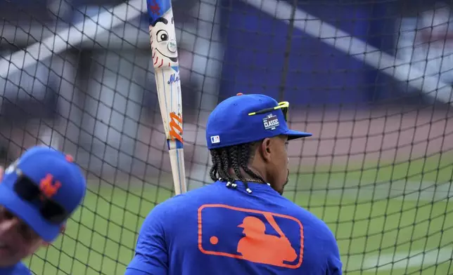 New York Mets' Francisco Lindor holds his Players' Weekend bat while waiting his turn in the batting cage before the Little League Classic baseball game against the Seattle Mariners at Bowman Field in Williamsport, Pa., Sunday, Aug. 17, 2025. (AP Photo/Gene J. Puskar)