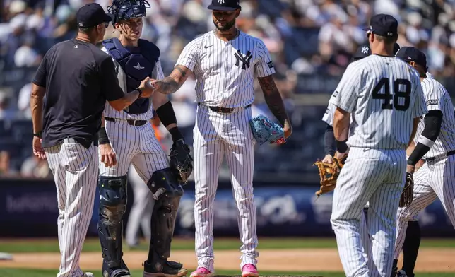 New York Yankees pitcher Luis Gil walks off the mound during the sixth inning of a baseball game against the Houston Astros, Saturday, Aug. 9, 2025, in New York. (AP Photo/Yuki Iwamura)