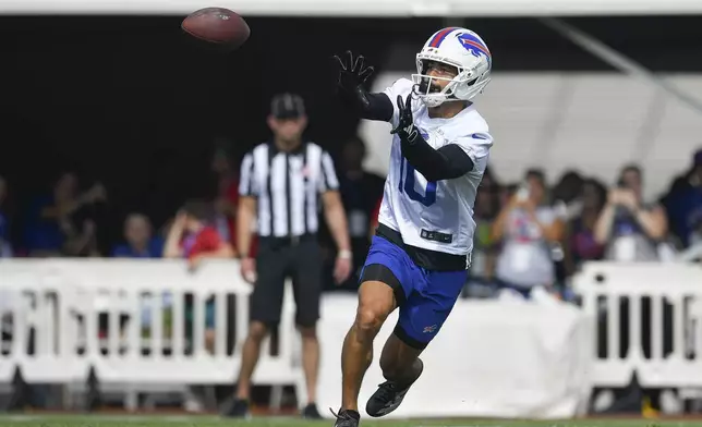 Buffalo Bills wide receiver Khalil Shakir (10) catches a pass during practice at the team's NFL football training camp, Sunday, July 27, 2025, in Pittsford, N.Y. (AP Photo/Adrian Kraus)