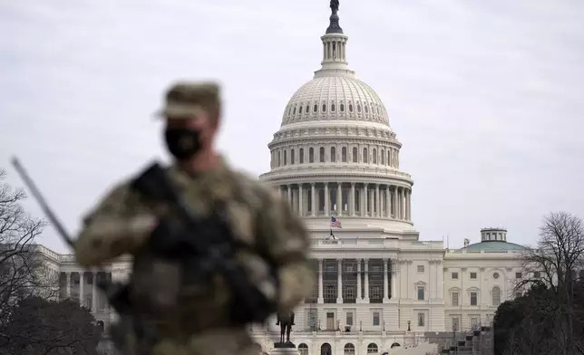 FILE - A member of the National Guard patrols the area outside of the U.S. Capitol in Washington, Feb. 10, 2021. (AP Photo/Jose Luis Magana, File)
