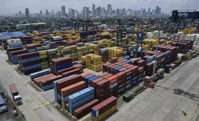 Stacks of containers are seen at the Manila North Harbour Port in Manila, Philippines, Thursday, Aug. 7, 2025. (AP Photo/Aaron Favila)