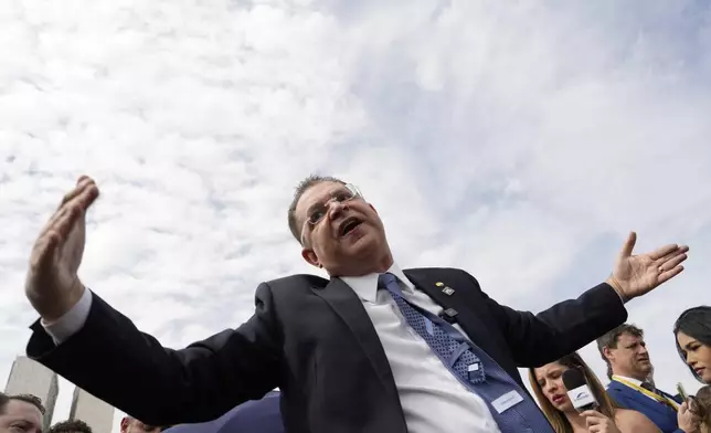 Sostenes Cavalcante, opposition leader and congressman, speaks during a press conference outside the National Congress in Brasília on Tuesday, Aug. 5, 2025, to denounce the house arrest order issued against Bolsonaro by Supreme Court Justice Alexandre de Moraes. (AP Photo/Eraldo Peres)