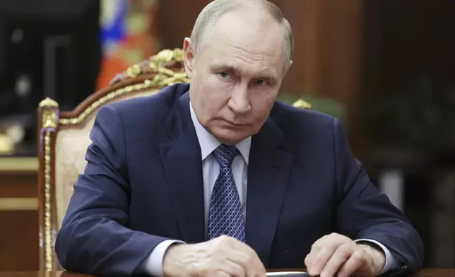 Russian President Vladimir Putin attends a meeting with Igor Shuvalov, the chairman of the Russian state development corporation VEB.RF, at the Kremlin in Moscow, Russia, Tuesday, Aug. 5, 2025. (Mikhail Metzel, Sputnik, Kremlin Pool Photo via AP)