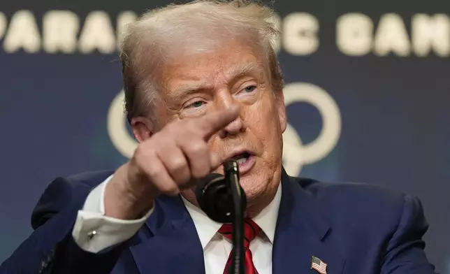 President Donald Trump answers questions from reporters after signing an executive order about the 2028 Los Angeles Olympic Games, in the South Court Auditorium of the Eisenhower Executive Office Building on the White House campus, Tuesday, Aug. 5, 2025, in Washington. (AP Photo/Alex Brandon)