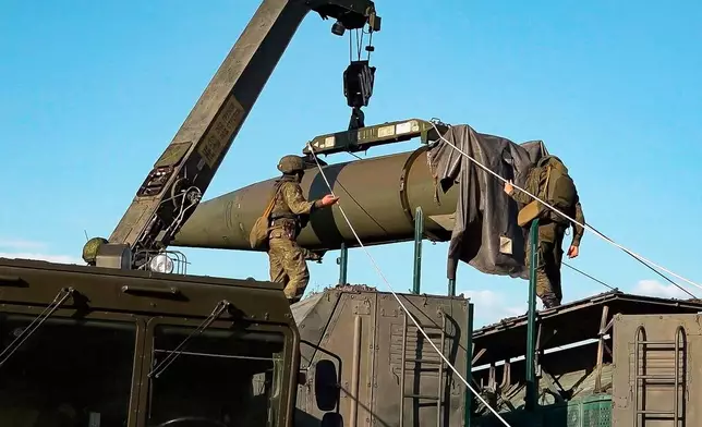 FILE - In this photo released by Russian Defense Ministry Press Service on May 21, 2024, Russian troops load an Iskander missile during a tactical nuclear weapon drill at an undisclosed location in Russia. (Russian Defense Ministry Press Service via AP, File)