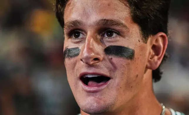 Boston Red Sox's Roman Anthony smiles while being interviewed after his winning walkoff single in the 10th inning of a baseball game against the Houston Astros at Fenway Park, Friday, Aug. 1, 2025, in Boston. (AP Photo/Charles Krupa)