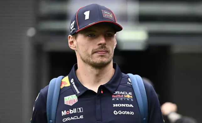 Red Bull Racing driver Max Verstappen of the Netherlands walks through the paddock at the Hungaroring racetrack, in Mogyorod, in Hungary, Sunday, Aug. 3, 2025, ahead of the Hungarian Formula One Grand Prix. (AP Photo/Denes Erdos)