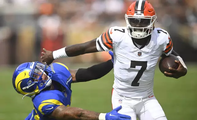Cleveland Browns quarterback Tyler Huntley (7) runs against Los Angeles Rams safety Malik Dixon-Williams (39) in the second half of an NFL preseason football game Saturday, Aug. 23, 2025, in Cleveland. (AP Photo/David Richard)