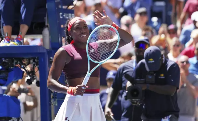 Coco Gauff, of the United States, waves after winning the match point against Magdalena Frech, of Poland, during the third round of the U.S. Open tennis championships, Saturday, Aug. 30, 2025, in New York. (AP Photo/Kirsty Wigglesworth)
