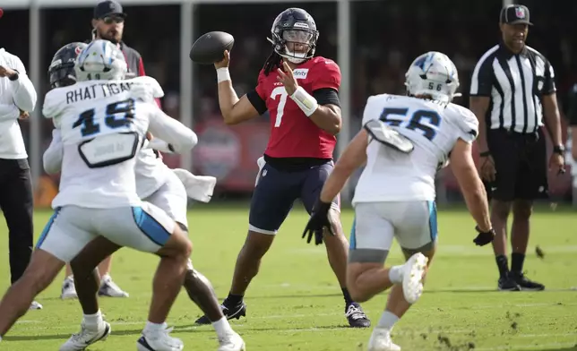 Houston Texans quarterback C.J. Stroud (7) throws during a joint NFL football practice with the Carolina Panthers Thursday, Aug. 14, 2025, in Houston. (AP Photo/Ashley Landis)