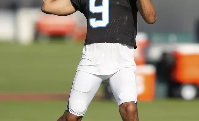 Carolina Panthers quarterback Bryce Young works out during a joint NFL football practice with the Houston Texans Thursday, Aug. 14, 2025, in Houston. (AP Photo/Ashley Landis)