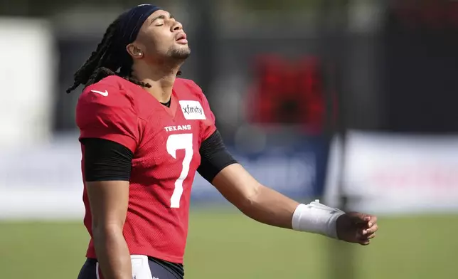 Houston Texans quarterback C.J. Stroud works out during a joint NFL football practice with the Carolina Panthers Thursday, Aug. 14, 2025, in Houston. (AP Photo/Ashley Landis)