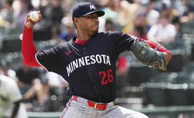 Minnesota Twins starting pitcher Taj Bradley throws against the Chicago White Sox during the first inning of a baseball game in Chicago, Sunday, Aug. 24, 2025. (AP Photo/Nam Y. Huh)