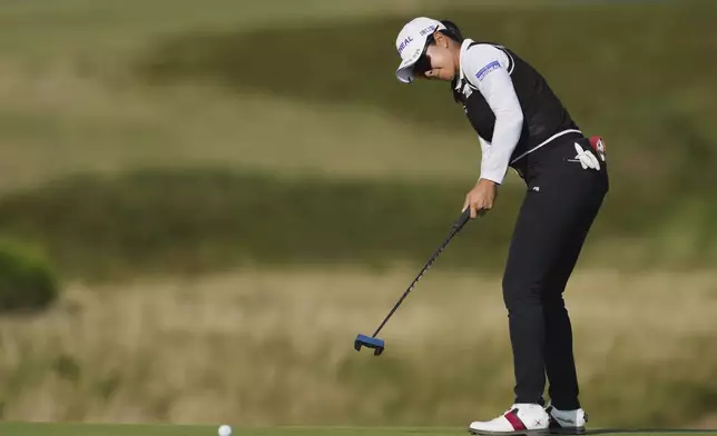 A Lim Kin of Korea putts on the 16th green during the third round of the Women's British Open golf championship, at Royal Porthcawl Golf Club in Porthcawl, Wales, Saturday, Aug. 2, 2025. (AP Photo/Kin Cheung)
