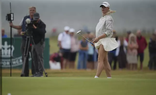 Charley Hull of England reacts after putting on the 17th green during the third round of the Women's British Open golf championship, at Royal Porthcawl Golf Club in Porthcawl, Wales, Saturday, Aug. 2, 2025. (AP Photo/Kin Cheung)